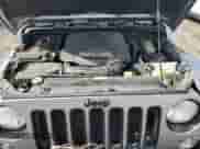 2014 Jeep Wrangler Sahara z VIN 1C4AJWBG0EL241643, wystawiony jako Copart lot #56491155 z przebiegiem 113 596 mil mil oraz Szkoda całkowita • Salvage title. Historia ofert i sprzedaży dostępna na DreamBid. Obrazek 11.