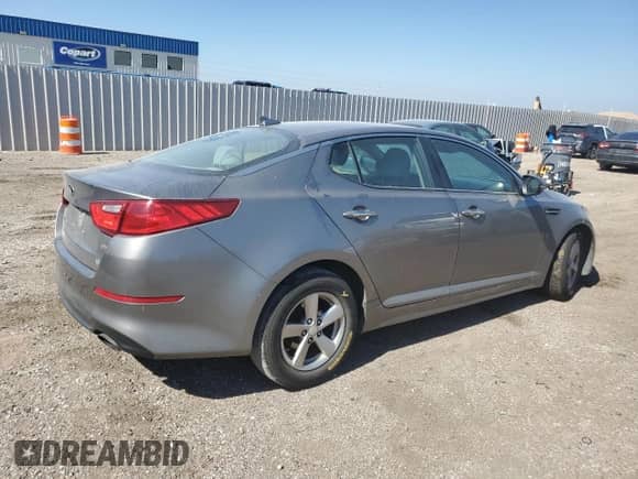 2014 Kia Optima LX с VIN 5XXGM4A73EG302524, выставлен на аукционе Copart как лот 81844855 с пробегом 185 440 миль миль и Списание • Salvage title. История ставок и продаж доступна на DreamBid. Изображение 3.