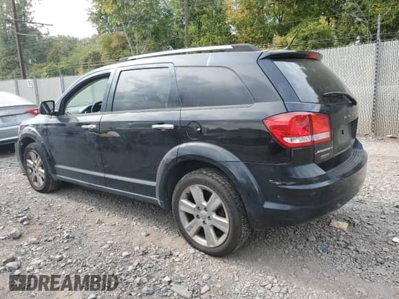 2014 Dodge Journey SE with VIN 3C4PDCAB9ET316849, listed as a Copart auction lot 82078595 with 127,374 mi miles and Salvage title. Bid and sale history available at DreamBid. Image 2.