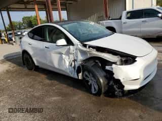 2023 Tesla Model Y Long Range with VIN 7SAYGAEE4PF863973, listed as a Copart auction lot 67838404 with 25,165 mi miles and Salvage title. Bid and sale history available at DreamBid. Image 4.