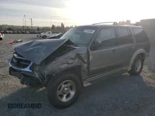 2000 Ford Explorer Eddie Bauer with VIN 1FMDU74E2YZB30465, listed as a Copart auction lot 87244384 with 166,225 mi miles and Salvage title. Bid and sale history available at DreamBid. Image 1.