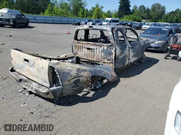 2014 Toyota Tacoma с VIN 5TFUU4EN4EX085067, выставлен на аукционе Copart как лот 62264825 с пробегом Не указан миль и Списание • Salvage title. История ставок и продаж доступна на DreamBid. Изображение 3.