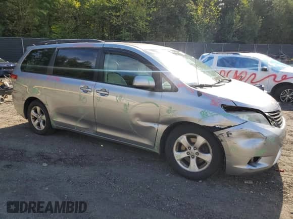 2011 Toyota Sienna LE with VIN 5TDKK3DC7BS089252, listed as a Copart auction lot 84197245 with 119,329 mi miles and Salvage title. Bid and sale history available at DreamBid. Image 4.