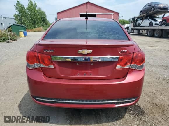2011 Chevrolet Cruze LTZ z VIN 1G1PH5S94B7170039, wystawiony jako Copart lot #67998895 z przebiegiem Nie podano mil oraz Szkoda całkowita • Salvage title. Historia ofert i sprzedaży dostępna na DreamBid. Obrazek 6.