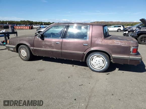 1989 Dodge Dynasty with VIN 1B3BC4637KD532206, listed as a Copart auction lot 74233744 with 85,245 mi miles and Clean title. Bid and sale history available at DreamBid. Image 2.