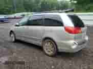 2010 Toyota Sienna XLE with VIN 5TDDK4CC3AS031671, listed as a Copart auction lot 67005405 with 155,177 mi miles and Clean title. Bid and sale history available at DreamBid. Image 2.