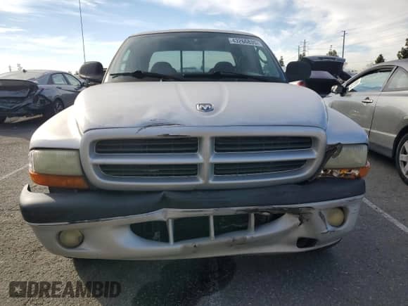 2002 Dodge Dakota Sport z VIN 1B7HL38N72S525267, wystawiony jako Copart lot #43266835 z przebiegiem 249 502 mil mil oraz Szkoda całkowita • Salvage title. Historia ofert i sprzedaży dostępna na DreamBid. Obrazek 5.