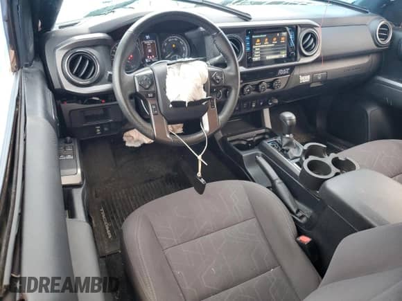 2019 Toyota Tacoma SR5 z VIN 5TFSZ5AN7KX184658, wystawiony jako Copart lot #71963065 z przebiegiem 32 476 mil mil oraz Szkoda całkowita • Salvage title. Historia ofert i sprzedaży dostępna na DreamBid. Obrazek 8.