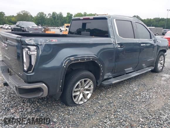 2021 GMC Sierra 1500 SLT with VIN 3GTU9DED9MG191347, listed as a IAAI auction lot 42918432 with 142,464 mi miles and . Bid and sale history available at DreamBid. Image 4.