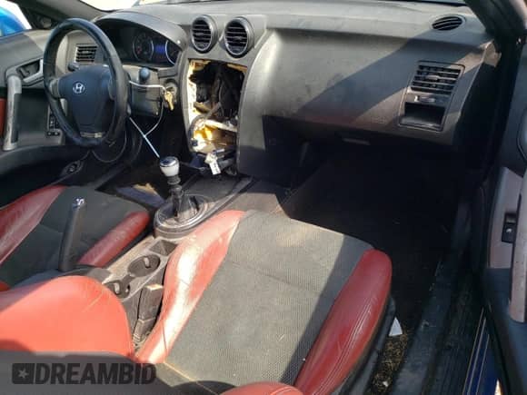 2007 Hyundai Tiburon GT с VIN KMHHN66F17U239526, выставлен на аукционе Copart как лот 64397625 с пробегом 136 807 миль миль и Списание • Salvage title. История ставок и продаж доступна на DreamBid. Изображение 8.