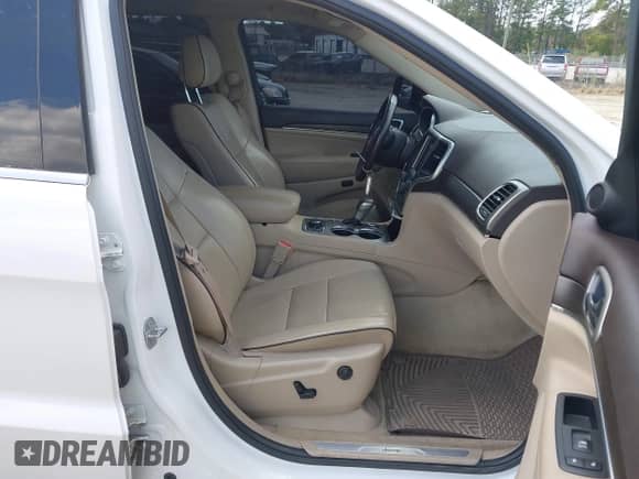 2018 Jeep Grand Cherokee Overland with VIN 1C4RJFCT4JC431275, listed as a IAAI auction lot 41931665 with 99,097 mi miles and . Bid and sale history available at DreamBid. Image 5.