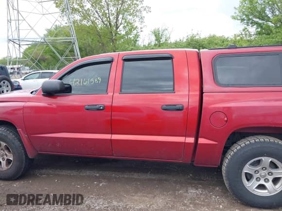 2007 Dodge Dakota SLT with VIN 1D7HW48JX7S215539, listed as a IAAI auction lot 42161589 with 180,813 mi miles and . Bid and sale history available at DreamBid. Image 14.