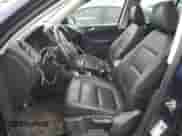 2013 Volkswagen Tiguan SE z VIN WVGAV3AX9DW056696, wystawiony jako Copart lot #54721695 z przebiegiem 108 656 mil mil oraz Szkoda całkowita • Salvage title. Historia ofert i sprzedaży dostępna na DreamBid. Obrazek 7.