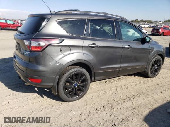 2017 Ford Escape Titanium z VIN 1FMCU9JD2HUC02846, wystawiony jako Copart lot #71730795 z przebiegiem 172 823 mil mil oraz Szkoda całkowita • Salvage title. Historia ofert i sprzedaży dostępna na DreamBid. Obrazek 3.