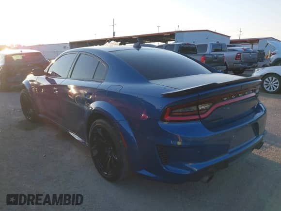 2023 Dodge Charger Scat Pack with VIN 2C3CDXGJ9PH686736, listed as a IAAI auction lot 43147477 with 19,328 mi miles and . Bid and sale history available at DreamBid. Image 3.