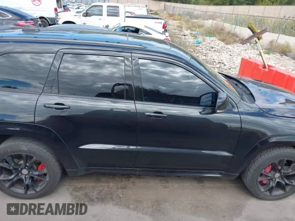 2016 Jeep Grand Cherokee SRT with VIN 1C4RJFDJ7GC399461, listed as a IAAI auction lot 43320500 with 97,123 mi miles and . Bid and sale history available at DreamBid. Image 14.