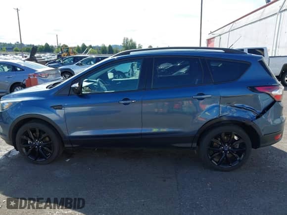 2018 Ford Escape SE z VIN 1FMCU9GD8JUA98392, wystawiony jako IAAI lot #42995836 z przebiegiem 104 260 mil mil oraz . Historia ofert i sprzedaży dostępna na DreamBid. Obrazek 14.