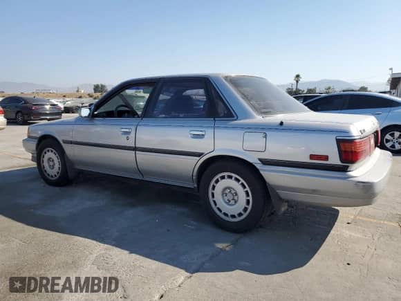 1990 Toyota Camry with VIN JT2VV22E3L3003353, listed as a Copart auction lot 68489125 with 131,662 mi miles and Clean title. Bid and sale history available at DreamBid. Image 2.