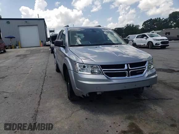 2018 Dodge Journey SE with VIN 3C4PDCAB0JT525021, listed as a Copart auction lot 64236265 with 104,675 mi miles and Salvage title. Bid and sale history available at DreamBid. Image 14.
