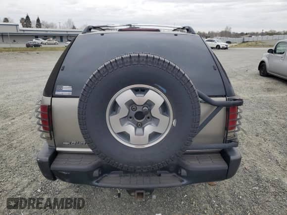 2001 Chevrolet Blazer LS z VIN 1GNCT18W91K167036, wystawiony jako Copart lot #47848415 z przebiegiem 145 278 mil mil oraz Szkoda całkowita • Salvage title. Historia ofert i sprzedaży dostępna na DreamBid. Obrazek 6.