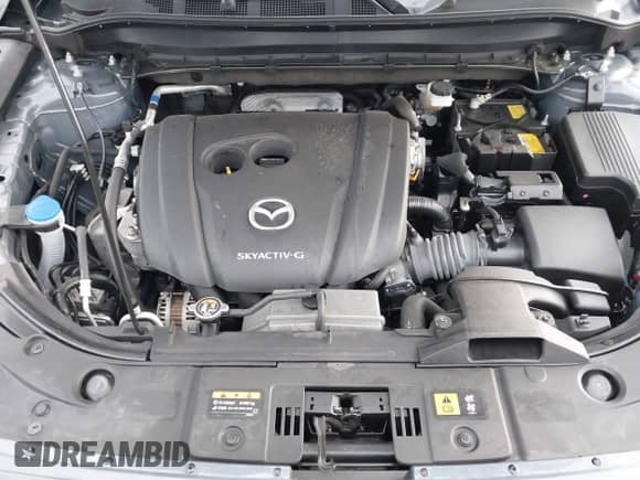 2022 Mazda CX-5 S Carbon Edition z VIN JM3KFBCM9N1538707, wystawiony jako IAAI lot #42026877 z przebiegiem 36 077 mil mil oraz . Historia ofert i sprzedaży dostępna na DreamBid. Obrazek 10.