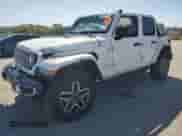 2024 Jeep Wrangler Sahara with VIN 1C4PJXEG1RW262694, listed as a Copart auction lot 71324645 with 12,760 mi miles and Salvage title. Bid and sale history available at DreamBid. Image 1.