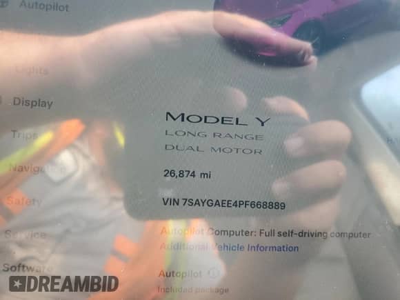2023 Tesla Model Y Long Range with VIN 7SAYGAEE4PF668889, listed as a Copart auction lot 67239314 with 26,874 mi miles and Salvage title. Bid and sale history available at DreamBid. Image 9.