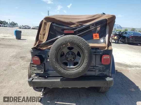 2003 Jeep Wrangler X z VIN 1J4FA39S43P357281, wystawiony jako Copart lot #67979335 z przebiegiem Nie podano mil oraz Szkoda całkowita • Salvage title. Historia ofert i sprzedaży dostępna na DreamBid. Obrazek 6.