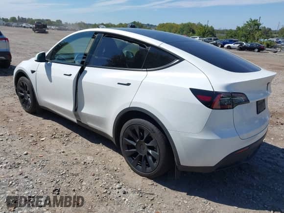 2023 Tesla Model Y Long Range with VIN 7SAYGDEE9PA033911, listed as a IAAI auction lot 43202182 with 35,938 mi miles and . Bid and sale history available at DreamBid. Image 3.