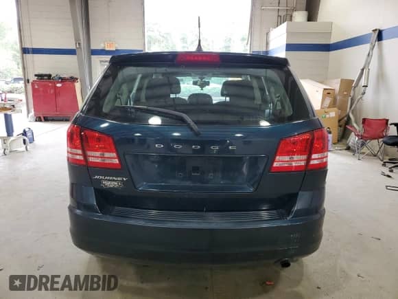 2014 Dodge Journey American Value with VIN 3C4PDCAB6ET245951, listed as a Copart auction lot 71156905 with 141,144 mi miles and Salvage title. Bid and sale history available at DreamBid. Image 6.