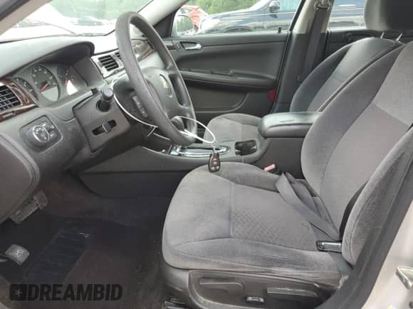 2014 Chevrolet Impala LS z VIN 2G1WA5E33E1141740, wystawiony jako Copart lot #63278725 z przebiegiem 149 083 mil mil oraz Szkoda całkowita • Salvage title. Historia ofert i sprzedaży dostępna na DreamBid. Obrazek 7.