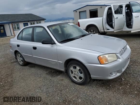 2000 Hyundai Accent with VIN KMHCG45G8YU120795, listed as a Copart auction lot 61005175 with 96,515 mi miles and Clean title. Bid and sale history available at DreamBid. Image 4.