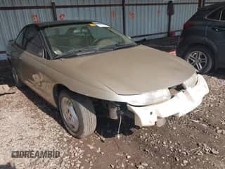 1997 Saturn 2dr Coupe with VIN 1G8ZH127XVZ333643, listed as a IAAI auction lot 42463504 with 104,295 mi miles and . Bid and sale history available at DreamBid. Image 1.