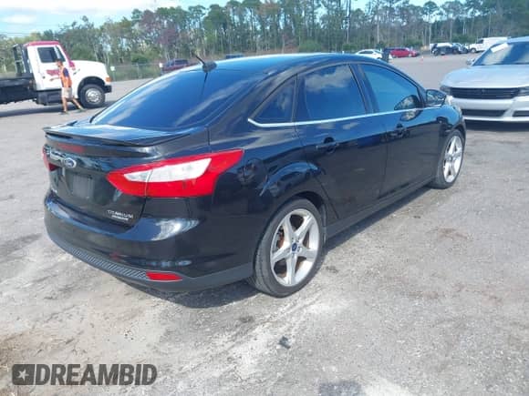 2013 Ford Focus Titanium with VIN 1FADP3J20DL295996, listed as a IAAI auction lot 43290832 with 150,000 mi miles and . Bid and sale history available at DreamBid. Image 4.