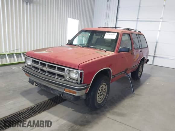 1993 Chevrolet Blazer z VIN 1GNDT13W2P2202181, wystawiony jako IAAI lot #42563244 z przebiegiem 143 439 mil mil oraz . Historia ofert i sprzedaży dostępna na DreamBid. Obrazek 6.