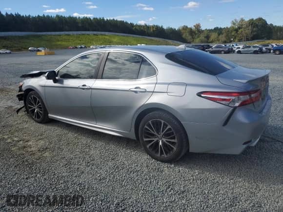 2020 Toyota Camry SE with VIN 4T1G11AK5LU873673, listed as a Copart auction lot 82445535 with 86,477 mi miles and Salvage title. Bid and sale history available at DreamBid. Image 2.