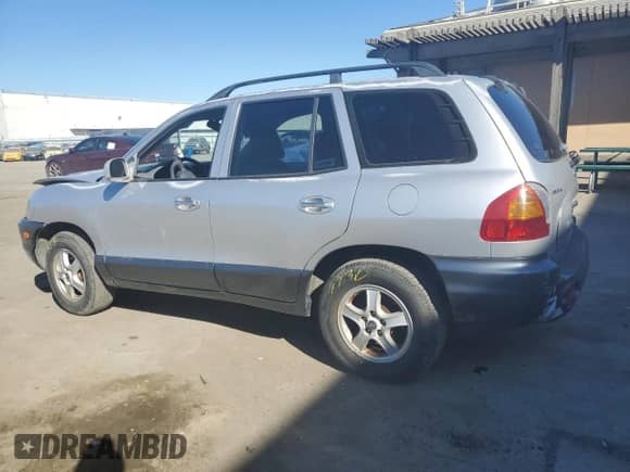 2001 Hyundai Santa Fe GLS z VIN KM8SC83D51U097893, wystawiony jako Copart lot #42773215 z przebiegiem 113 181 mil mil oraz Szkoda całkowita • Salvage title. Historia ofert i sprzedaży dostępna na DreamBid. Obrazek 2.