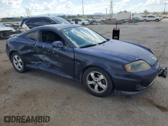 2006 Hyundai Tiburon GS с VIN KMHHM65D26U218704, выставлен на аукционе Copart как лот 80553255 с пробегом 211 718 миль миль и Списание • Salvage title. История ставок и продаж доступна на DreamBid. Изображение 4.