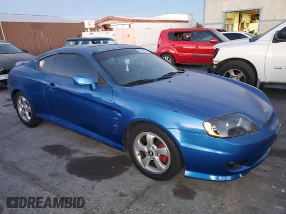 2005 Hyundai Tiburon GS with VIN KMHHM65D65U183681, listed as a Copart auction lot 86779914 with 190,575 mi miles and Clean title. Bid and sale history available at DreamBid. Image 4.