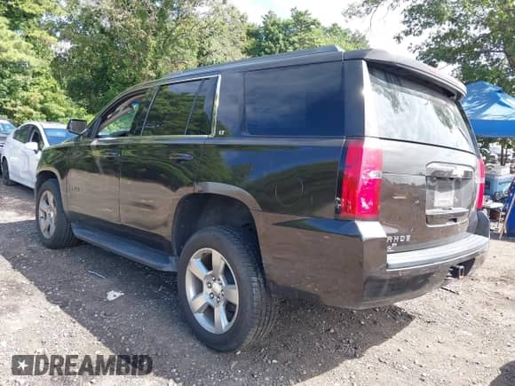 2018 Chevrolet Tahoe LT with VIN 1GNSKBKC4JR156035, listed as a IAAI auction lot 43009937 with 152,555 mi miles and . Bid and sale history available at DreamBid. Image 3.