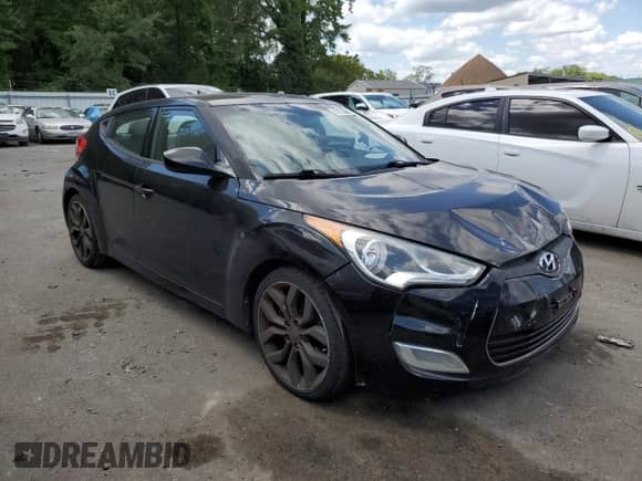 2012 Hyundai Veloster w/Gray Int z VIN KMHTC6AD8CU046631, wystawiony jako Copart lot #68106965 z przebiegiem 120 090 mil mil oraz Szkoda całkowita • Salvage title. Historia ofert i sprzedaży dostępna na DreamBid. Obrazek 4.