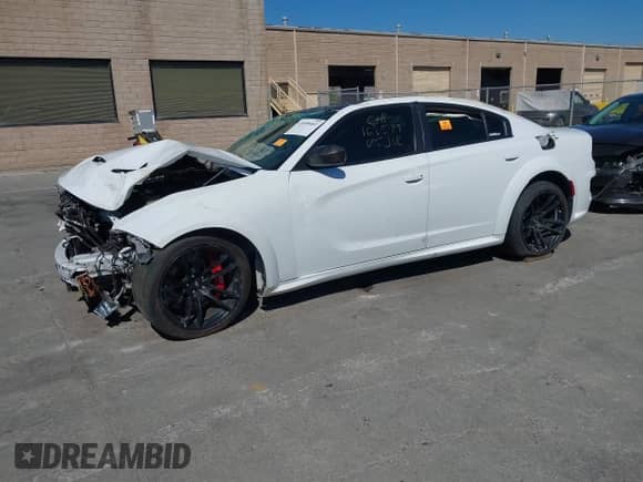 2022 Dodge Charger Scat Pack with VIN 2C3CDXGJ3NH159370, listed as a IAAI auction lot 42690462 with 35,123 mi miles and . Bid and sale history available at DreamBid. Image 2.