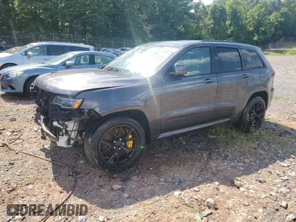 2021 Jeep Grand Cherokee Trackhawk z VIN 1C4RJFN93MC757896, wystawiony jako Copart lot #64594125 z przebiegiem 9 400 mil mil oraz Szkoda całkowita • Salvage title. Historia ofert i sprzedaży dostępna na DreamBid. Obrazek 1.