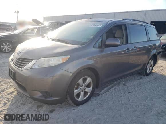 2012 Toyota Sienna LE with VIN 5TDKK3DC5CS231390, listed as a Copart auction lot 85662385 with 125,918 mi miles and Salvage title. Bid and sale history available at DreamBid. Image 1.