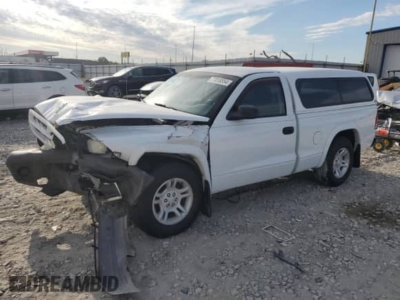 2003 Dodge Dakota z VIN 1D7FL16XX3S353971, wystawiony jako Copart lot #77018554 z przebiegiem Nie podano mil oraz Szkoda całkowita • Salvage title. Historia ofert i sprzedaży dostępna na DreamBid. Obrazek 1.