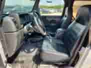 2004 Jeep Wrangler X z VIN 1J4FA39S34P798854, wystawiony jako Copart lot #71769025 z przebiegiem 167 178 mil mil oraz Szkoda całkowita • Salvage title. Historia ofert i sprzedaży dostępna na DreamBid. Obrazek 7.