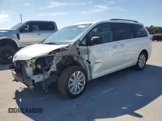 2012 Toyota Sienna XLE AAS with VIN 5TDYK3DC8CS190893, listed as a Copart auction lot 89573505 with 145,575 mi miles and Salvage title. Bid and sale history available at DreamBid. Image 1.
