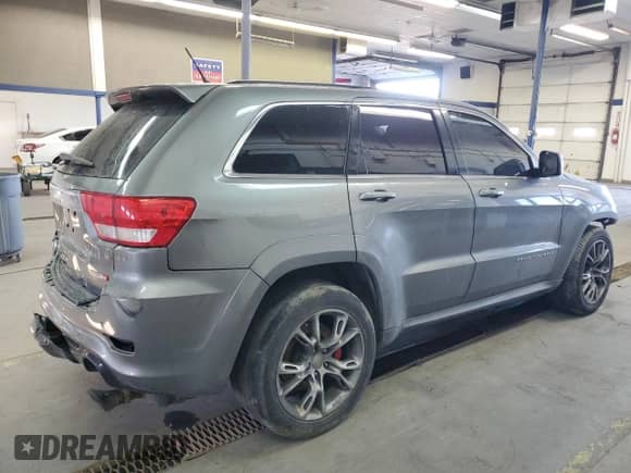 2012 Jeep Grand Cherokee SRT-8 z VIN 1C4RJFDJ8CC205823, wystawiony jako Copart lot #48073195 z przebiegiem 133 828 mil mil oraz Szkoda całkowita • Salvage title. Historia ofert i sprzedaży dostępna na DreamBid. Obrazek 3.