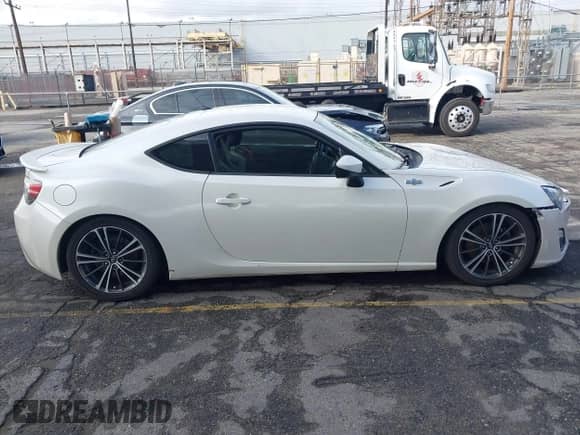 2014 Scion FR-S z VIN JF1ZNAA13E9701999, wystawiony jako IAAI lot #43442477 z przebiegiem 150 402 mil mil oraz . Historia ofert i sprzedaży dostępna na DreamBid. Obrazek 13.