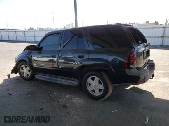 2003 Chevrolet TrailBlazer LTZ z VIN 1GNDT13S932135702, wystawiony jako Copart lot #65800125 z przebiegiem Nie podano mil oraz Szkoda całkowita • Salvage title. Historia ofert i sprzedaży dostępna na DreamBid. Obrazek 2.